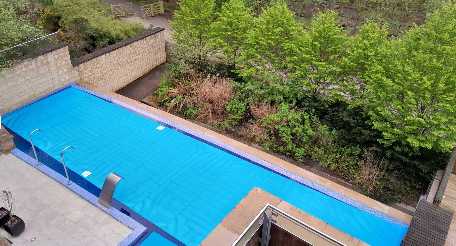 Aqua Sana outdoor pool from above, surrounded by forest